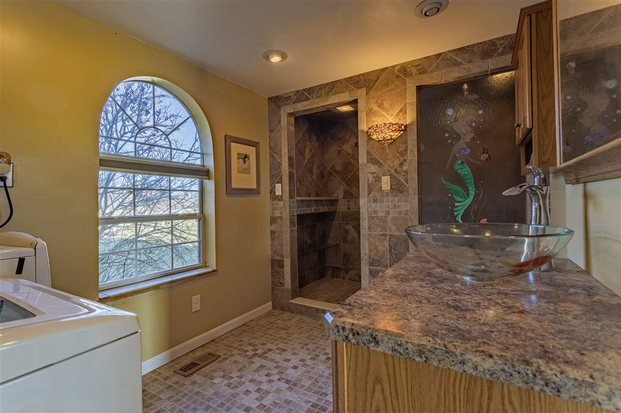 15283 Trask Bridge Road Pecatonica, IL 61063 - Photo 6 of 25 a room with painting on the wall and a window