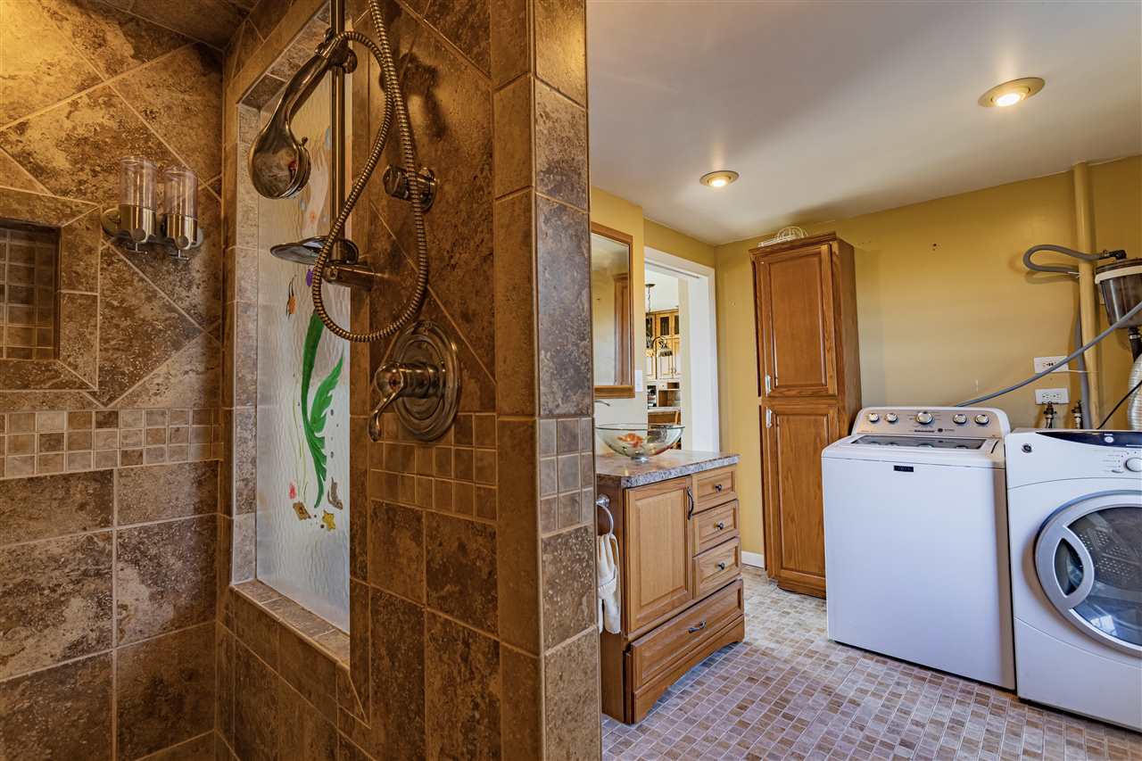 15283 Trask Bridge Road Pecatonica, IL 61063 - Photo 7 of 25 a bathroom with a washer and dryer