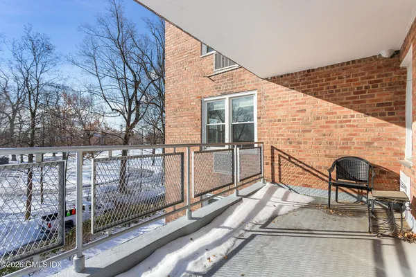 a view of house with outdoor seating