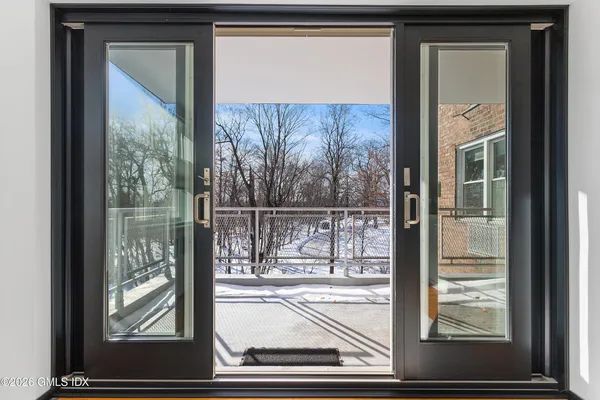 a view of a glass door and a window