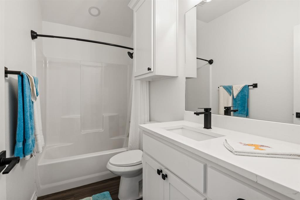103 St James Mount Mount Pleasant, TX 75455 - Photo 21 of 39 a bathroom with a sink toilet and shower