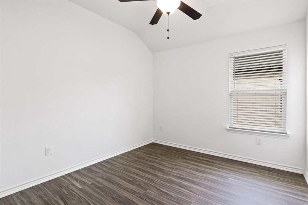 103 St James Mount Mount Pleasant, TX 75455 - Photo 23 of 39 an empty room with a window with a ceiling fan