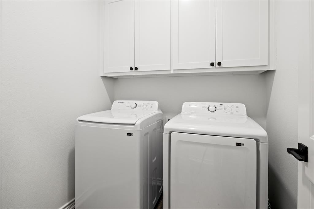 103 St James Mount Mount Pleasant, TX 75455 - Photo 24 of 39 a utility room with dryer and washer