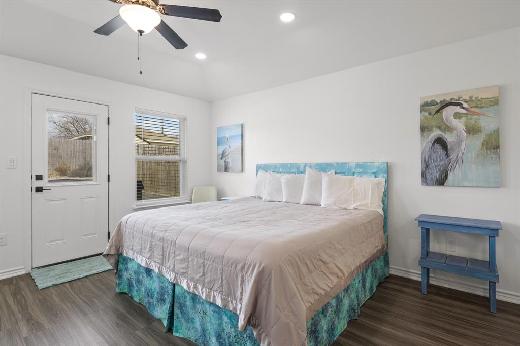 103 St James Mount Mount Pleasant, TX 75455 - Photo 25 of 39 a bedroom with a bed and a chandelier