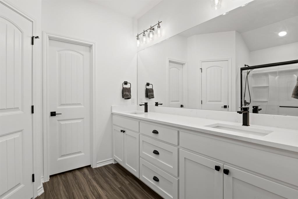103 St James Mount Mount Pleasant, TX 75455 - Photo 27 of 39 a bathroom with double vanity sink a mirror and vanity