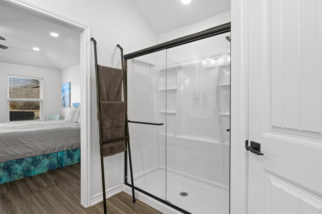 103 St James Mount Mount Pleasant, TX 75455 - Photo 29 of 39 a bathroom with a glass shower door and a glass door shower
