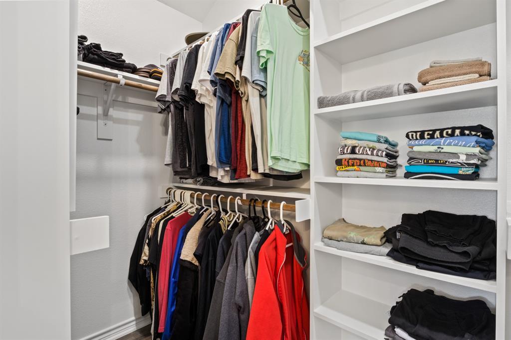 103 St James Mount Mount Pleasant, TX 75455 - Photo 31 of 39 a view of walk in closet with clothes and shoes