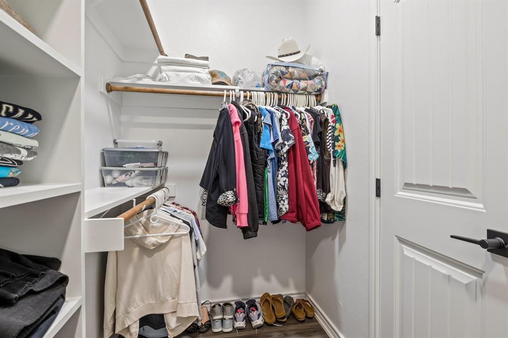 103 St James Mount Mount Pleasant, TX 75455 - Photo 32 of 39 a view of walk in closet with clothes and shoes