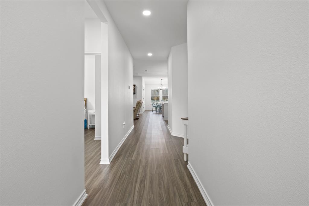 103 St James Mount Mount Pleasant, TX 75455 - Photo 4 of 39 a view of a hallway with wooden floor