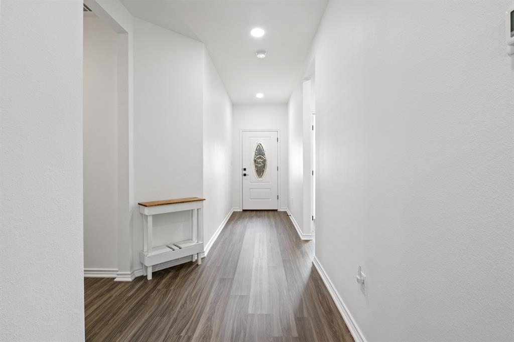 103 St James Mount Mount Pleasant, TX 75455 - Photo 5 of 39 a view of a hallway with wooden floor and closet