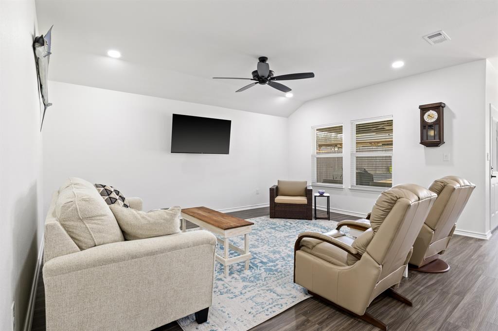 103 St James Mount Mount Pleasant, TX 75455 - Photo 7 of 39 a living room with furniture a ceiling fan and a window