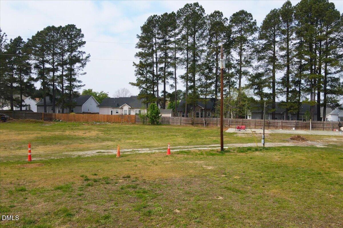 7201 Applecreek Court Raleigh, NC 27610 - Photo 16 of 17 a view of a swimming pool with a yard
