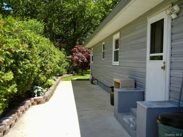 a stairs of the house with a yard