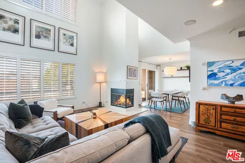 a bedroom with furniture and a fireplace