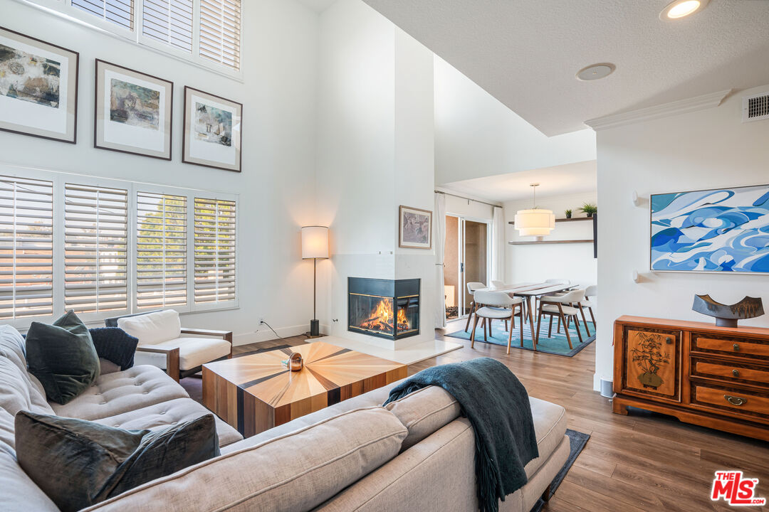 a bedroom with furniture and a fireplace