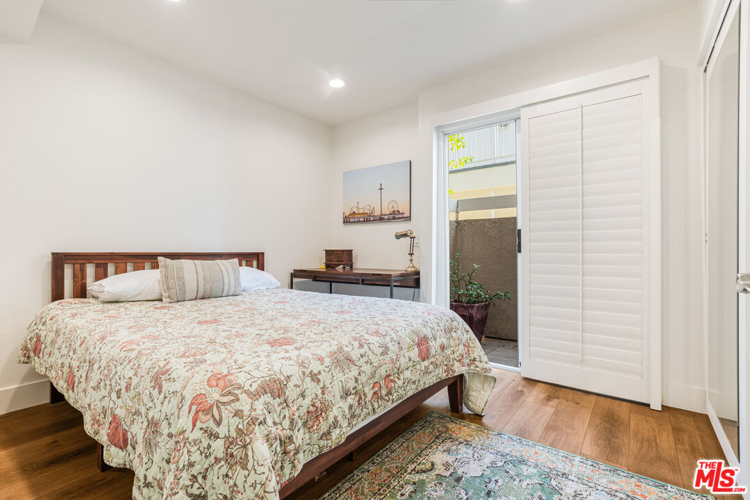 2808 Arizona Avenue, Unit 3 Santa Monica, CA 90404 - Photo 12 of 20 a bedroom with a bed and wooden floor