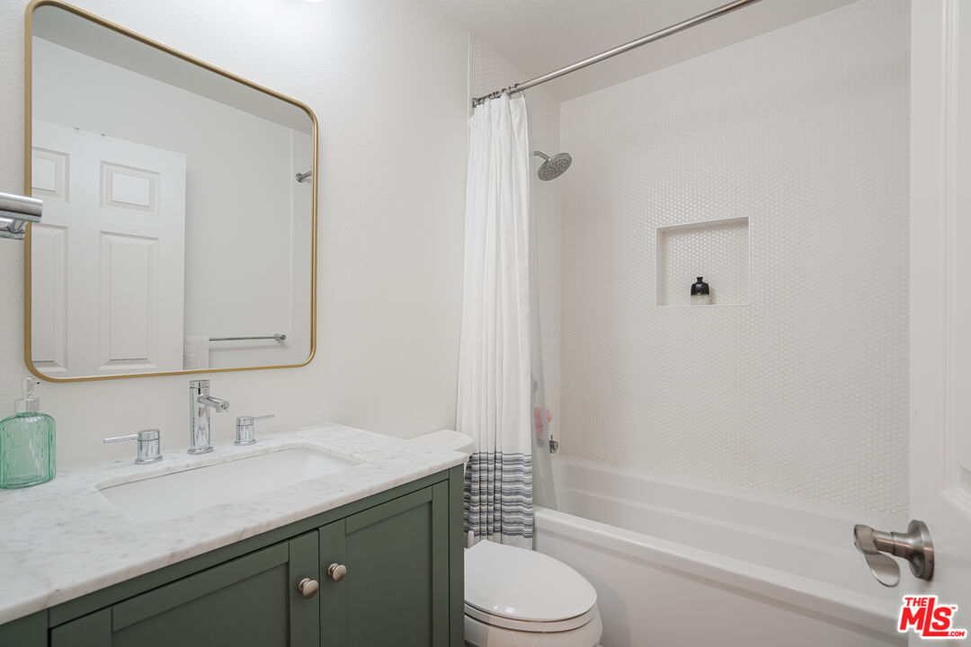 2808 Arizona Avenue, Unit 3 Santa Monica, CA 90404 - Photo 13 of 20 a bathroom with a granite countertop sink toilet and shower