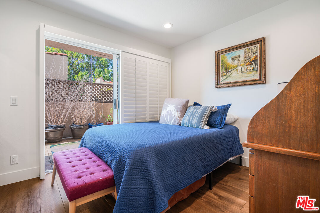 2808 Arizona Avenue, Unit 3 Santa Monica, CA 90404 - Photo 14 of 20 a bedroom with a bed and wooden floor
