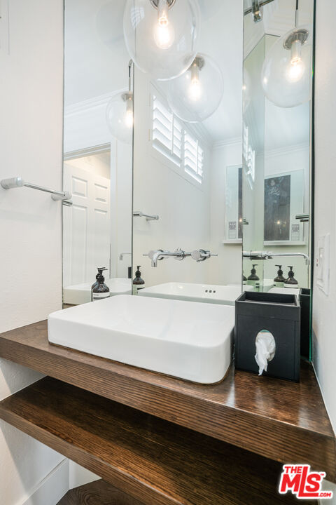 2808 Arizona Avenue, Unit 3 Santa Monica, CA 90404 - Photo 15 of 20 a bathroom with a sink and a mirror