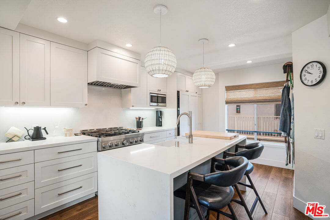 2808 Arizona Avenue, Unit 3 Santa Monica, CA 90404 - Photo 5 of 20 a kitchen with a sink stove and cabinets
