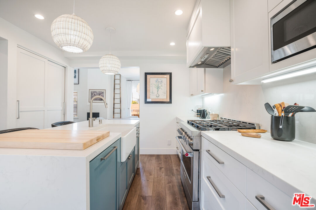 2808 Arizona Avenue, Unit 3 Santa Monica, CA 90404 - Photo 6 of 20 a kitchen with a sink a stove and cabinets