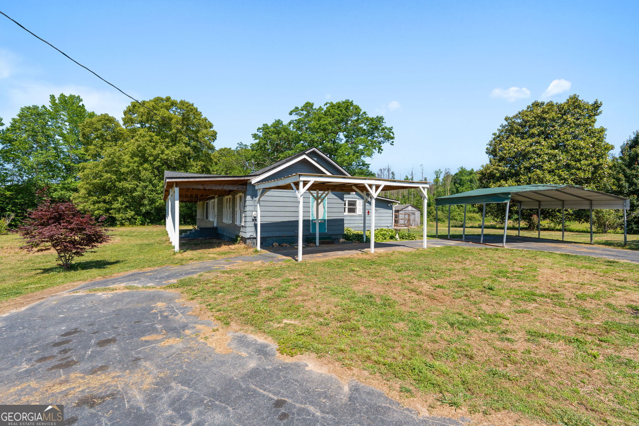 49 Frost Road Bowdon, GA 30108 - Photo 39 of 60 a front view of a house with a garden