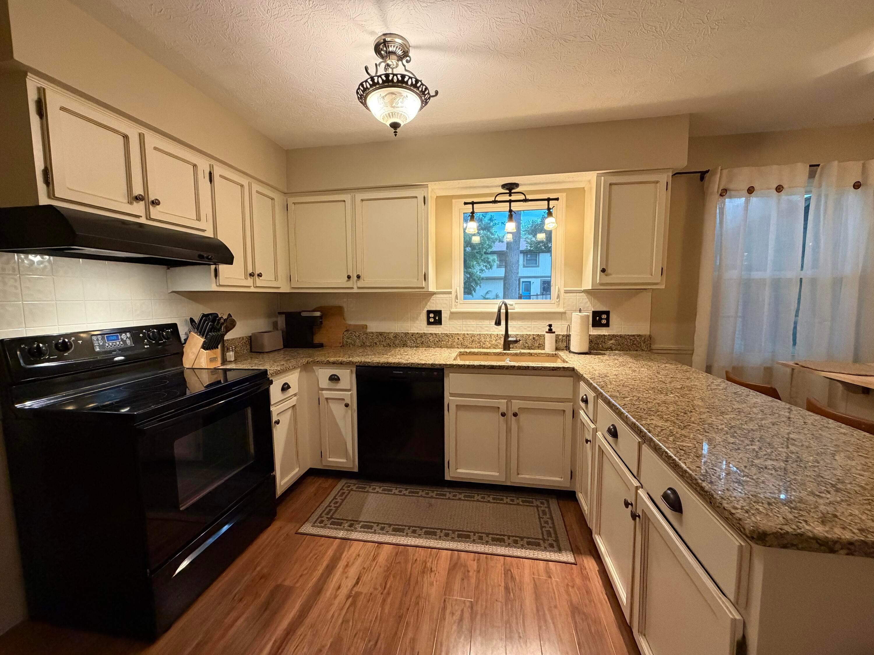 Granite countertops and French Country cabinets