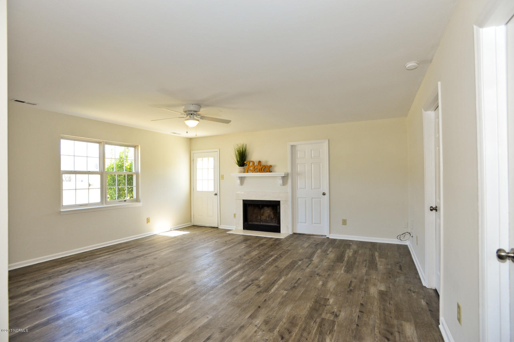 2050 Derby Run Road Jacksonville, NC 28546 - Photo 11 of 28 New laminate hardwood in main living area