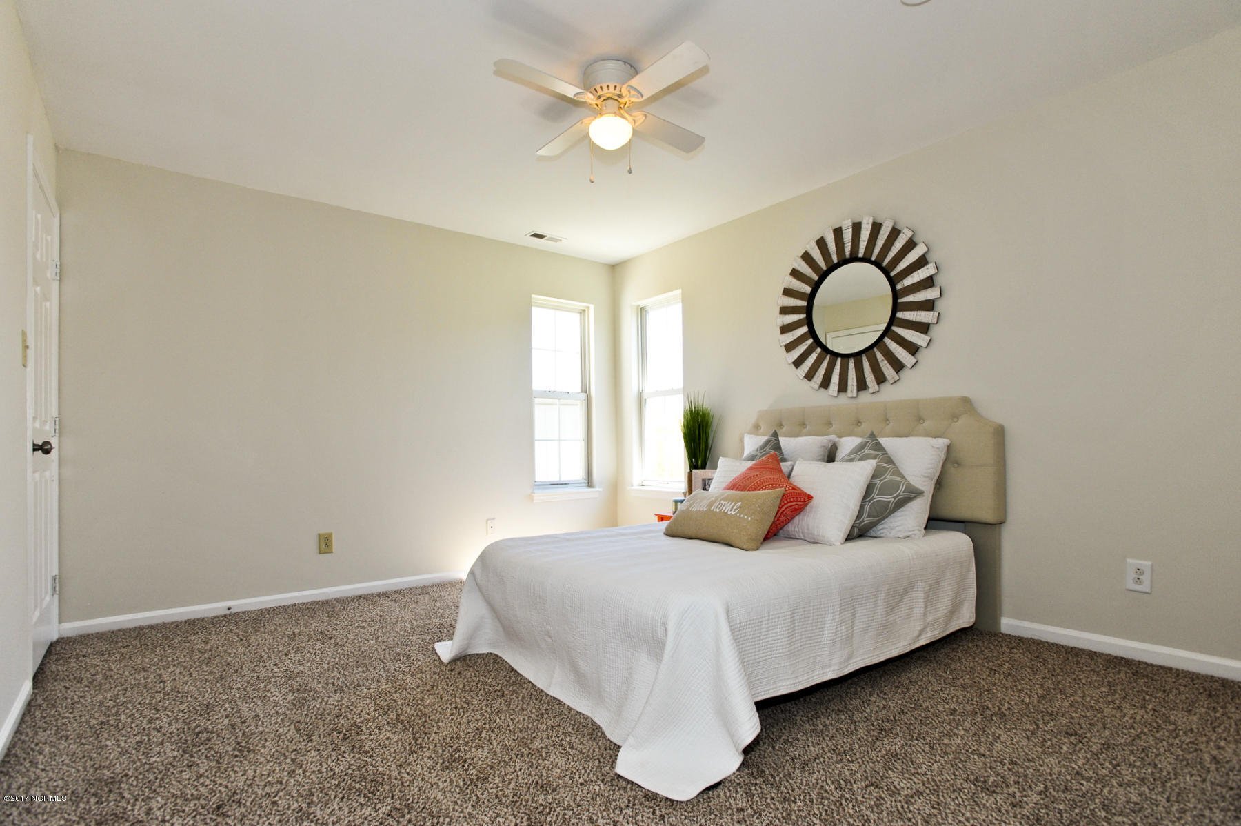 2050 Derby Run Road Jacksonville, NC 28546 - Photo 17 of 28 Master bedroom has new paint, new carpet & new light fixture.