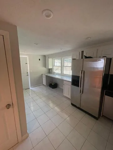 a kitchen with stainless steel appliances a refrigerator and a sink
