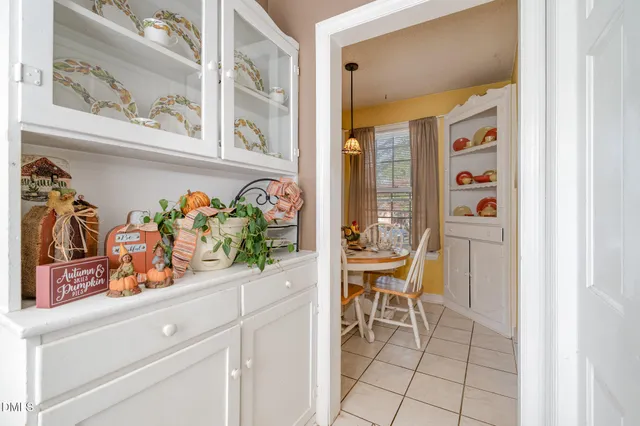 a view of a hallway with dining area