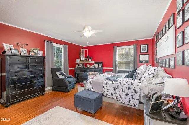 a bed room with a bed and a tv