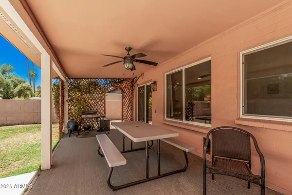 a view of a livingroom with furniture and a window