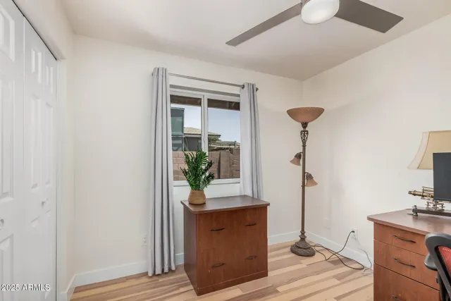 a view of hallway with furniture and a potted plant