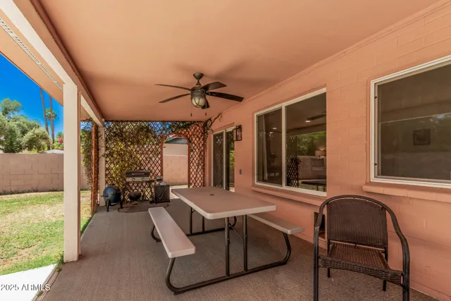 a view of a livingroom with furniture and a window
