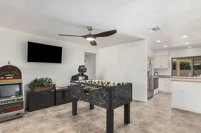 a livingroom with furniture and a flat screen tv