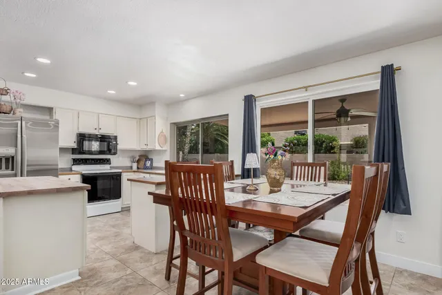 a view of a dining room with furniture window and outside view