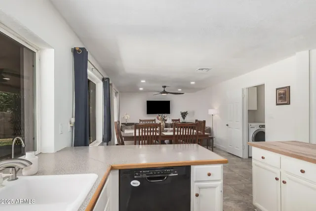 a kitchen with a stove and a sink
