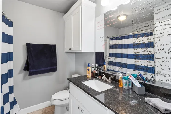 a kitchen with a sink and a stove top oven