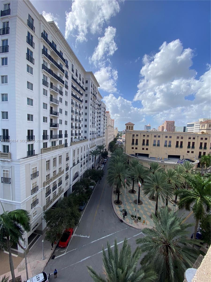 55 Merrick Way, Unit 800 Coral Gables, FL 33134 - Photo 1 of 33 a view of a balcony with plants and lake view