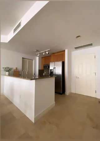 a view of a kitchen with a sink