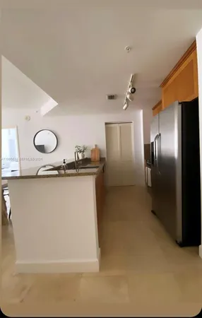 a view of a kitchen with a sink