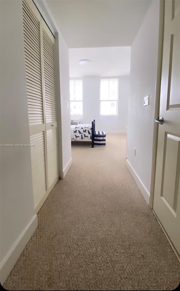 55 Merrick Way, Unit 800 Coral Gables, FL 33134 - Photo 17 of 33 an empty room with windows