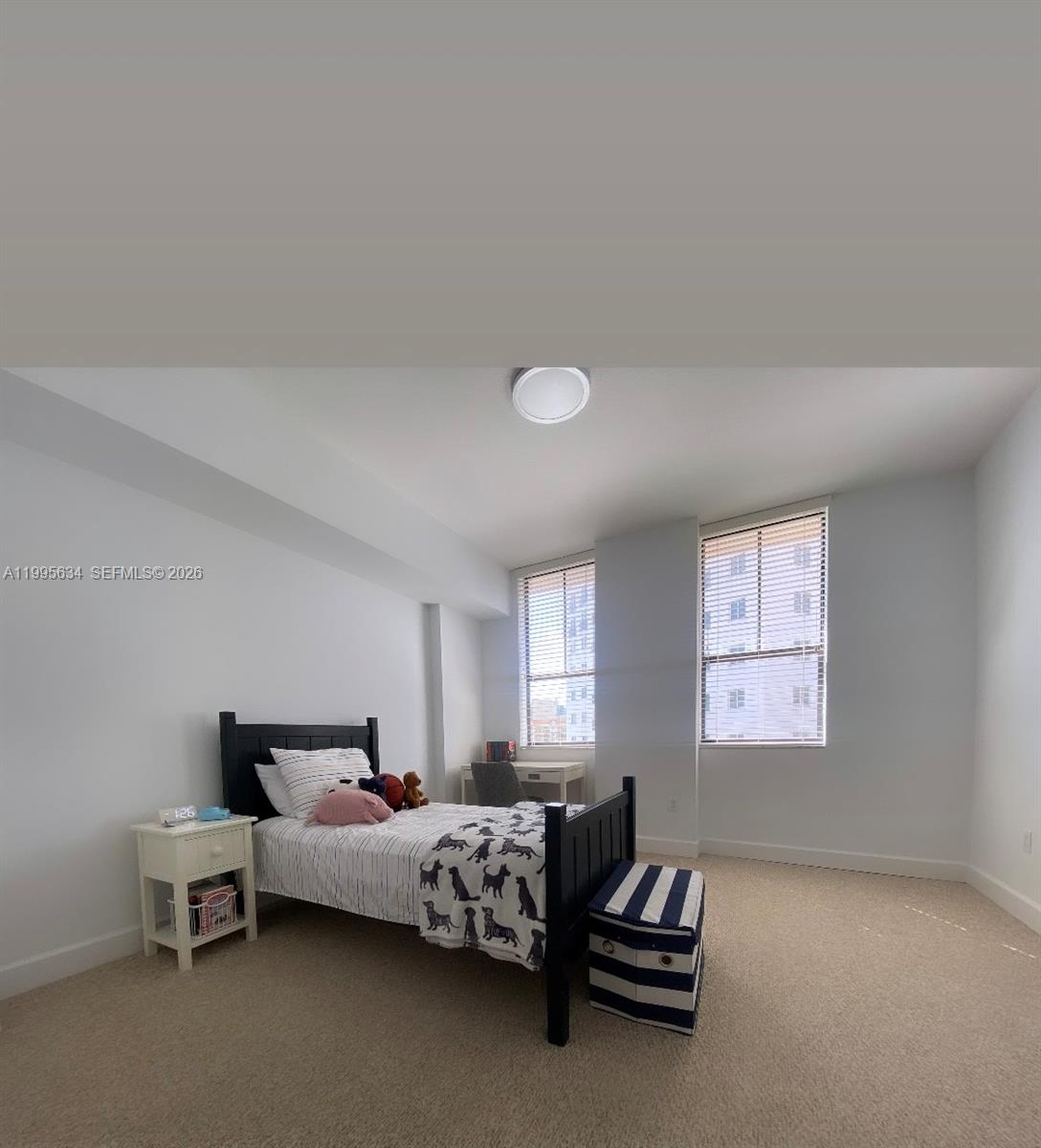 55 Merrick Way, Unit 800 Coral Gables, FL 33134 - Photo 19 of 33 a bedroom with bed and window