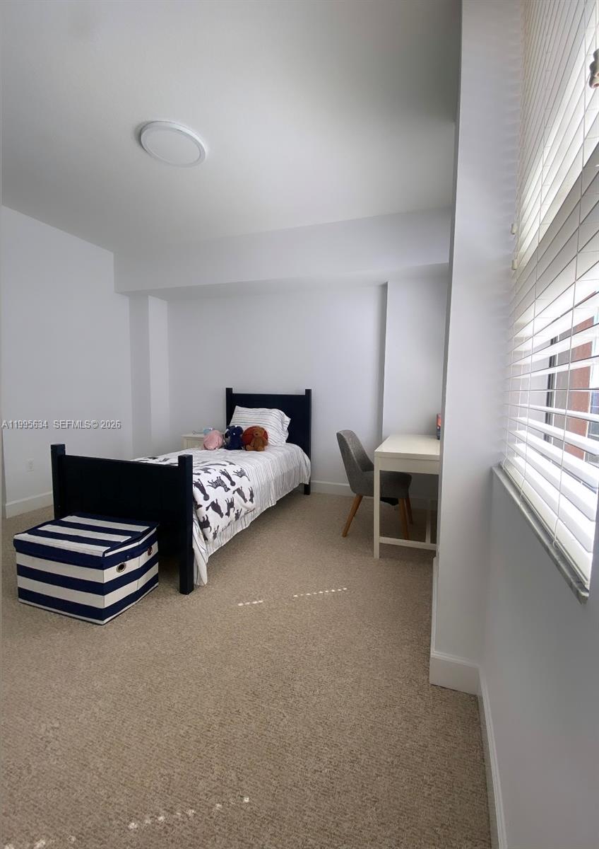 55 Merrick Way, Unit 800 Coral Gables, FL 33134 - Photo 20 of 33 a bedroom with furniture and windows