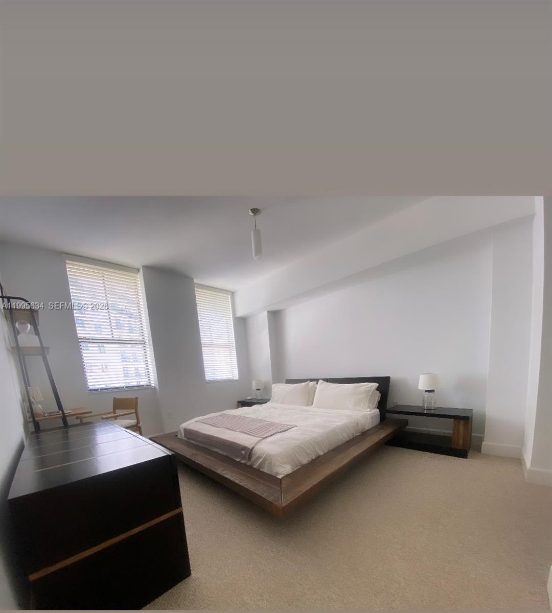 55 Merrick Way, Unit 800 Coral Gables, FL 33134 - Photo 22 of 33 a bedroom with bed and window