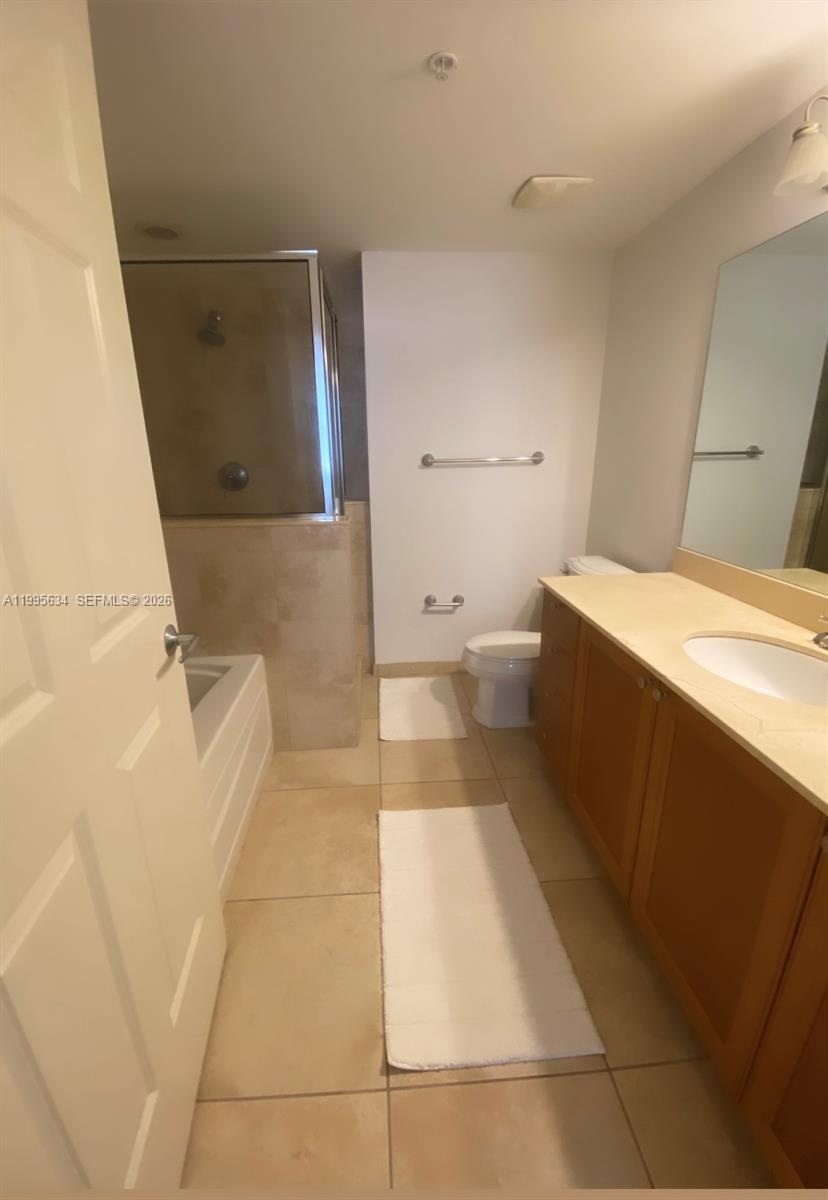 55 Merrick Way, Unit 800 Coral Gables, FL 33134 - Photo 25 of 33 a bathroom with a sink a toilet and shower