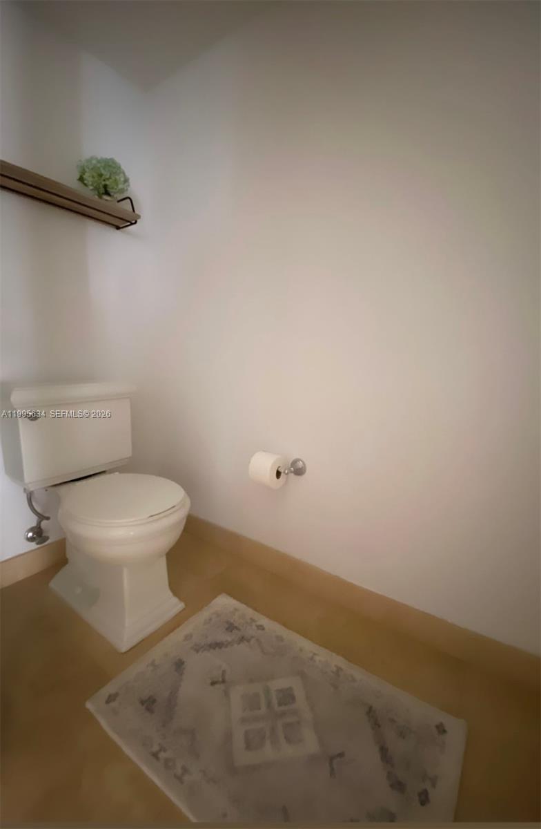 55 Merrick Way, Unit 800 Coral Gables, FL 33134 - Photo 7 of 33 a bathroom with a toilet and a vanity