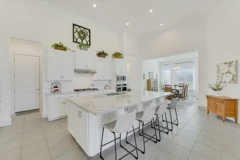 a view of kitchen with cabinets and wooden floor