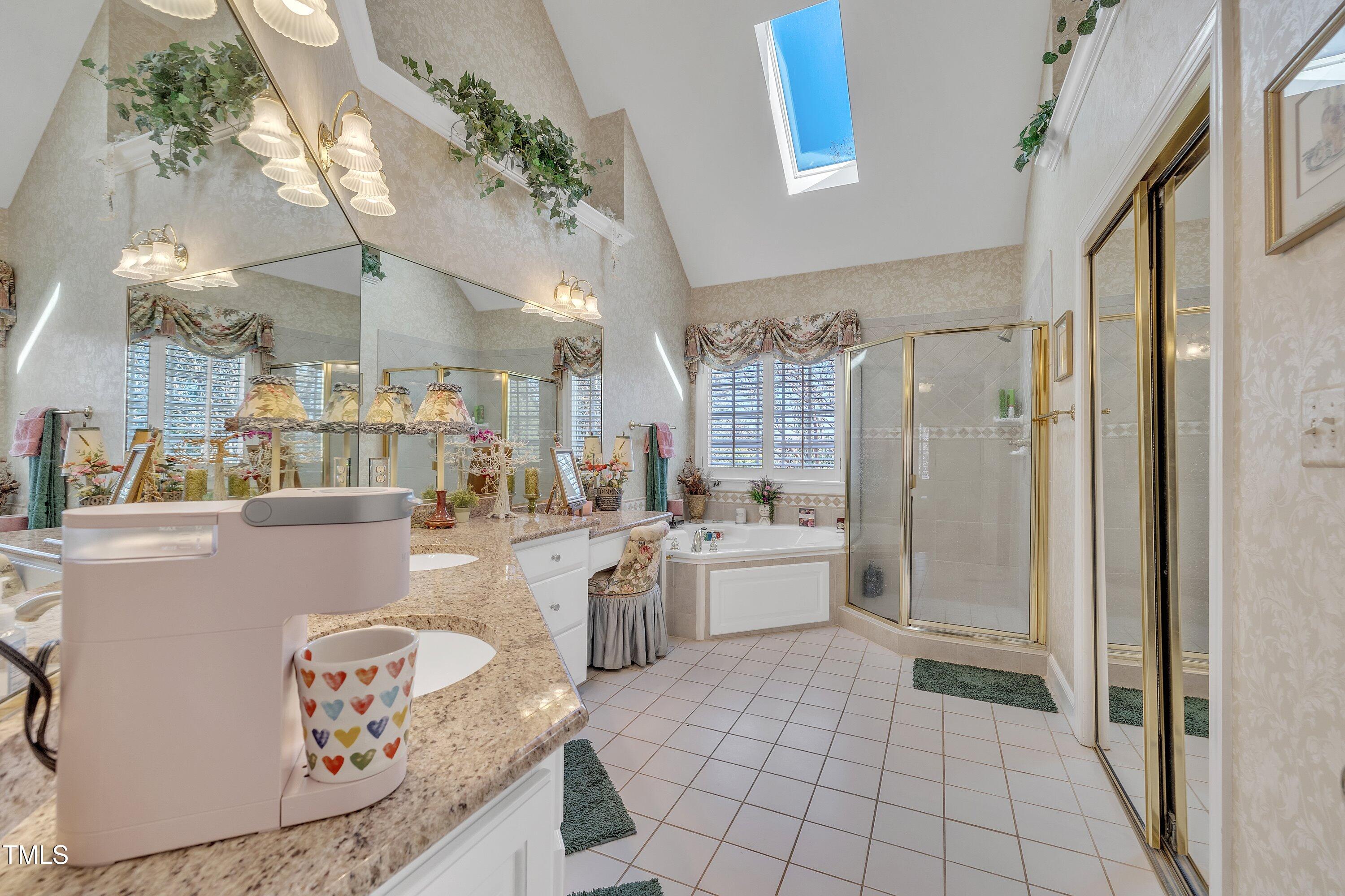 12504 Ribbongrass Court Raleigh, NC 27614 - Photo 27 of 51 Private primary bathroom is your spa at home w/vaulted ceiling, skylights & so much more!